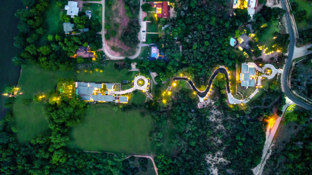 An aerial view of a resort at dusk, perfect for those looking to find an Agent or Austin Realtor.