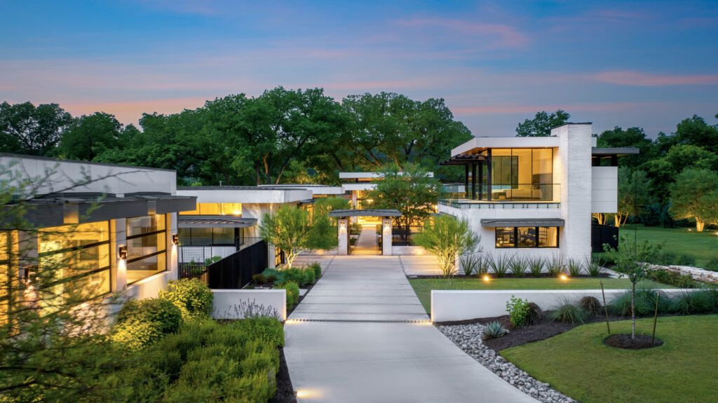 A modern home at dusk, perfect for a real estate chat.