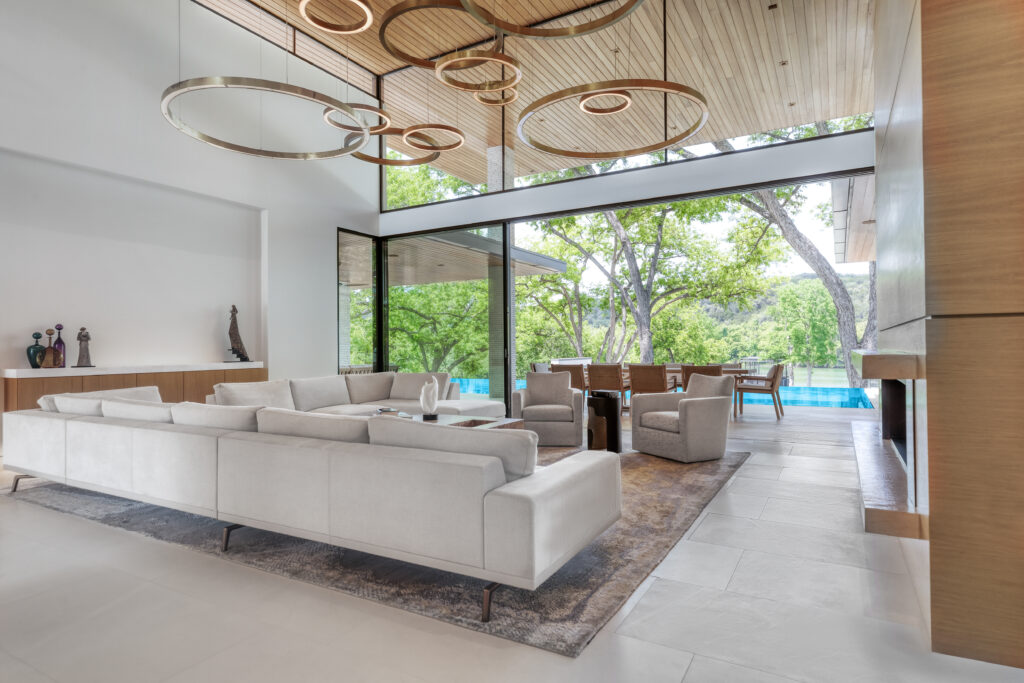 This modern living room features wooden ceilings and glass doors, perfect for home buyers looking for a stylish space.