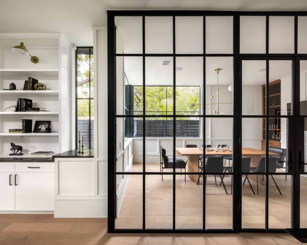A dining room with a sliding glass door is available in the real estate market. Contact our Austin realtor today for more information through real estate chat.